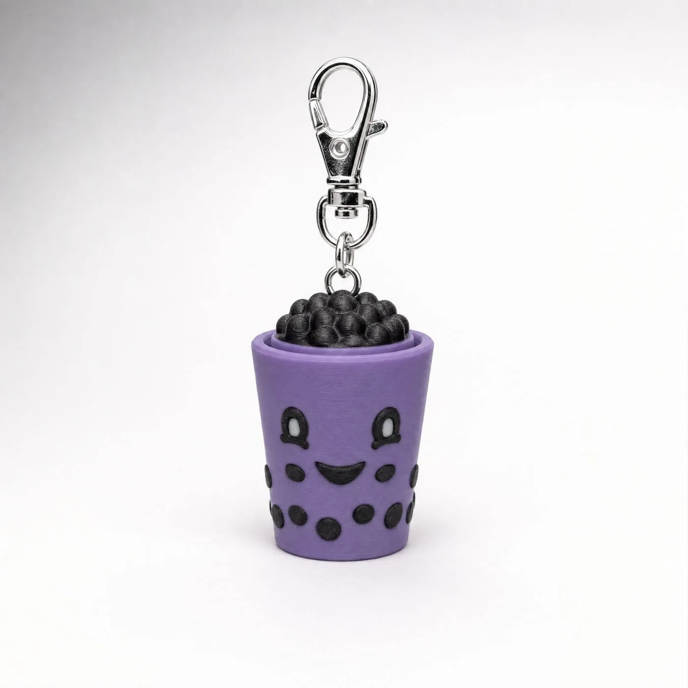 Purple boba cup 3D print with black bubbles and a silver keychain clip.